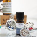 Verižice za eterična olja z različnimi motivi: drevo življenja, neskončnost in kačji pastir